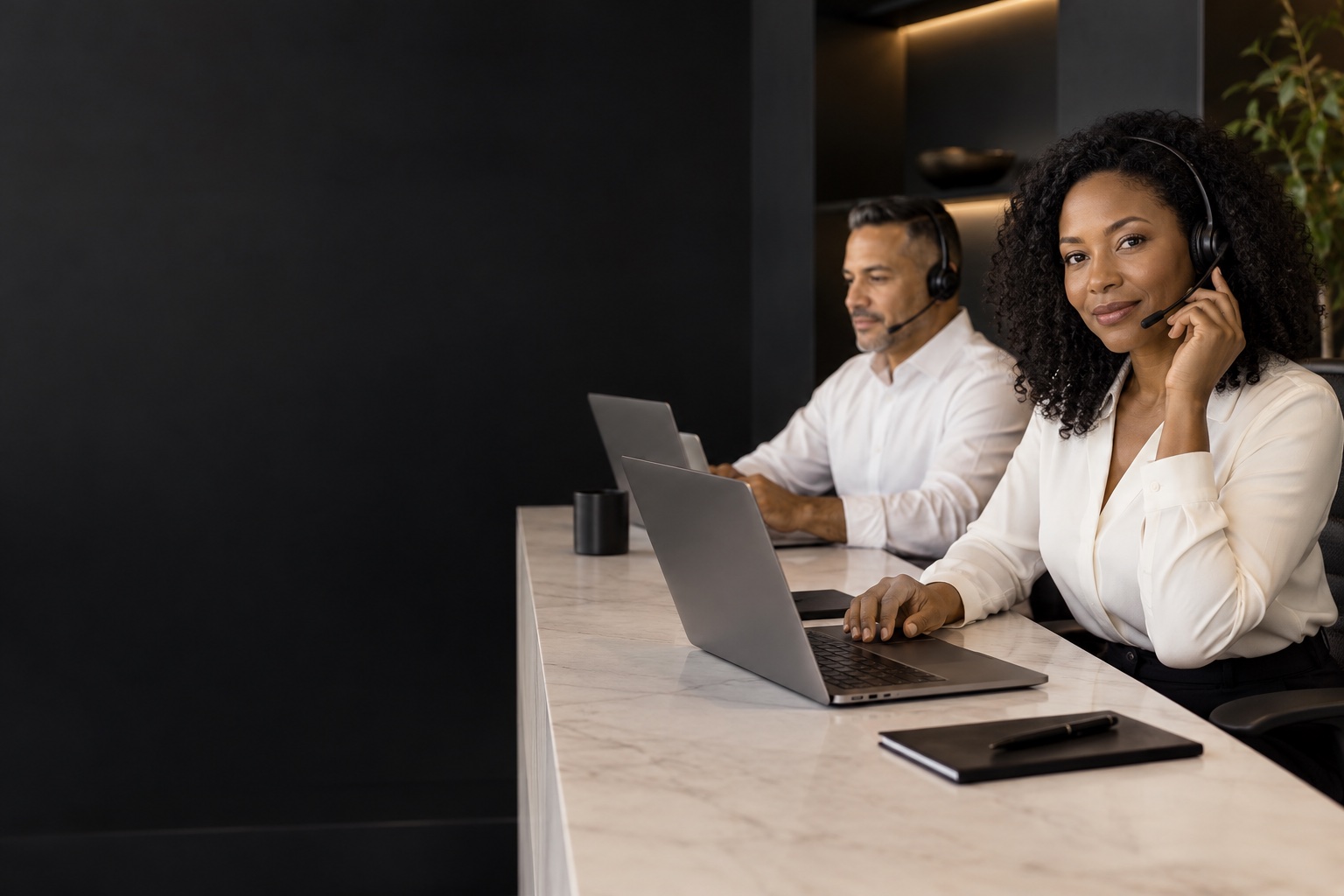 Customer Experience — professional in a warm charcoal and white workspace